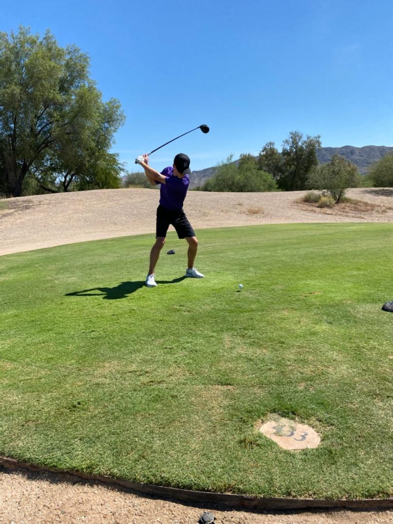 Students playing golf