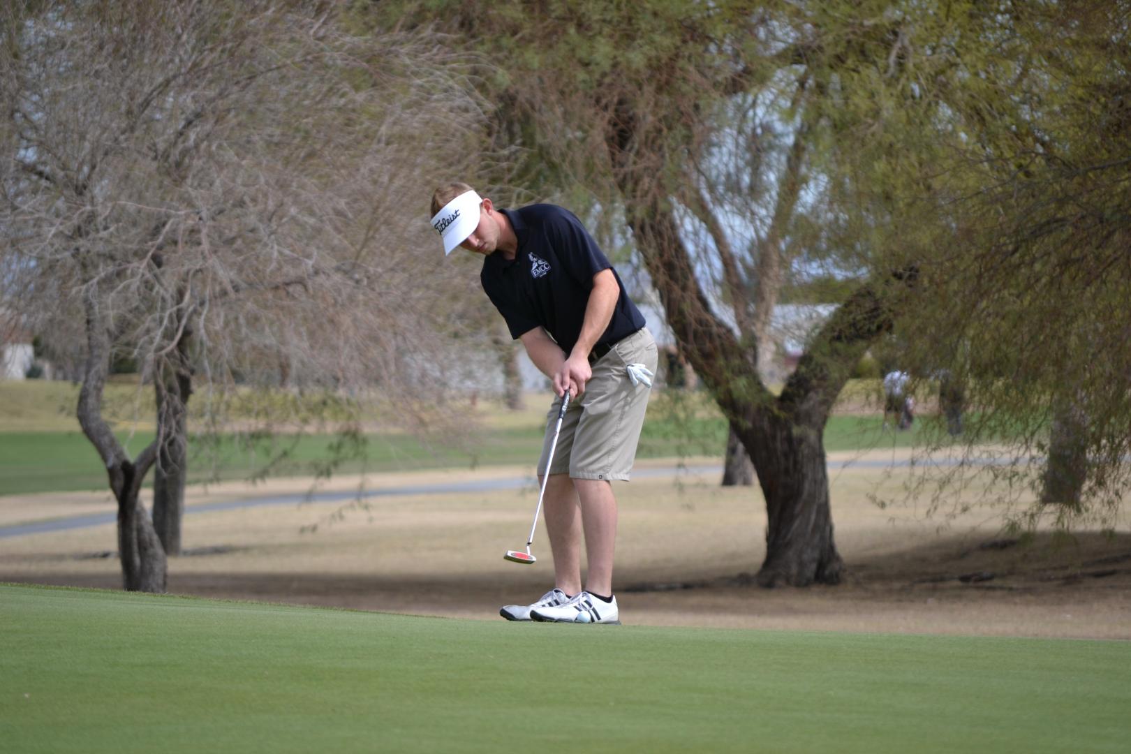 Students playing golf