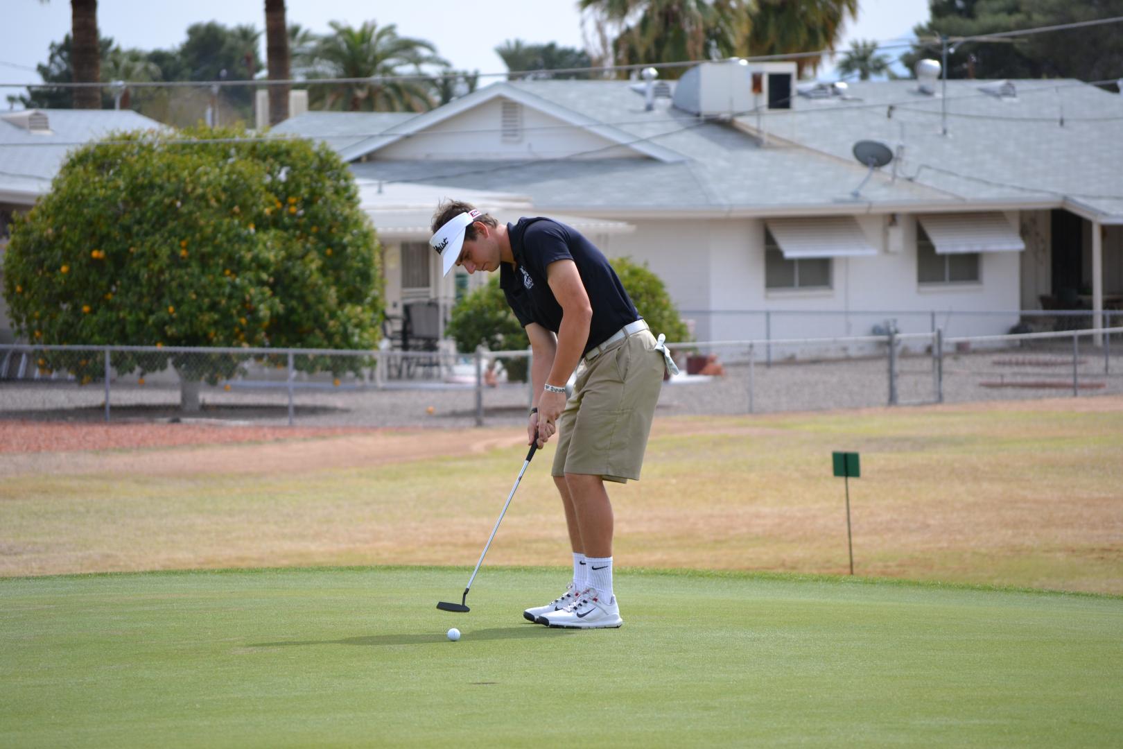 Students playing golf