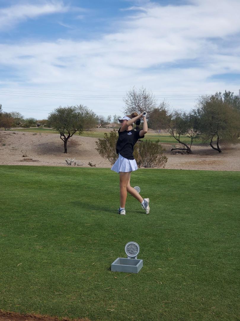 Students playing golf