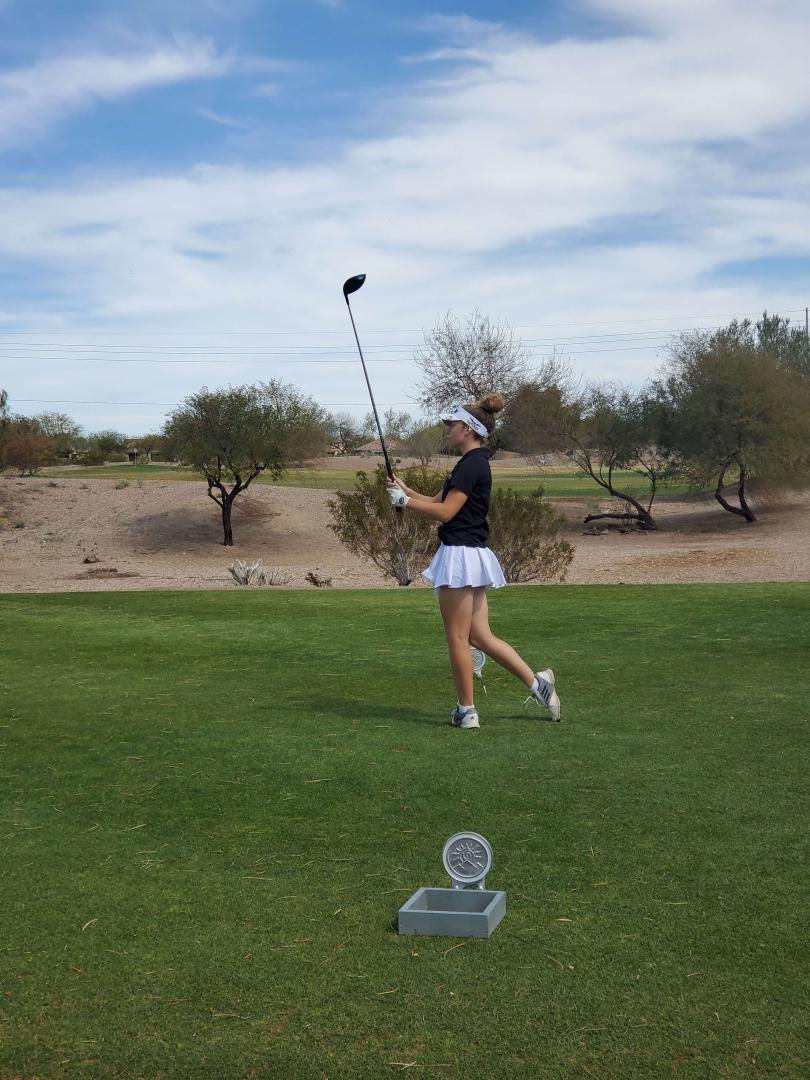 Students playing golf