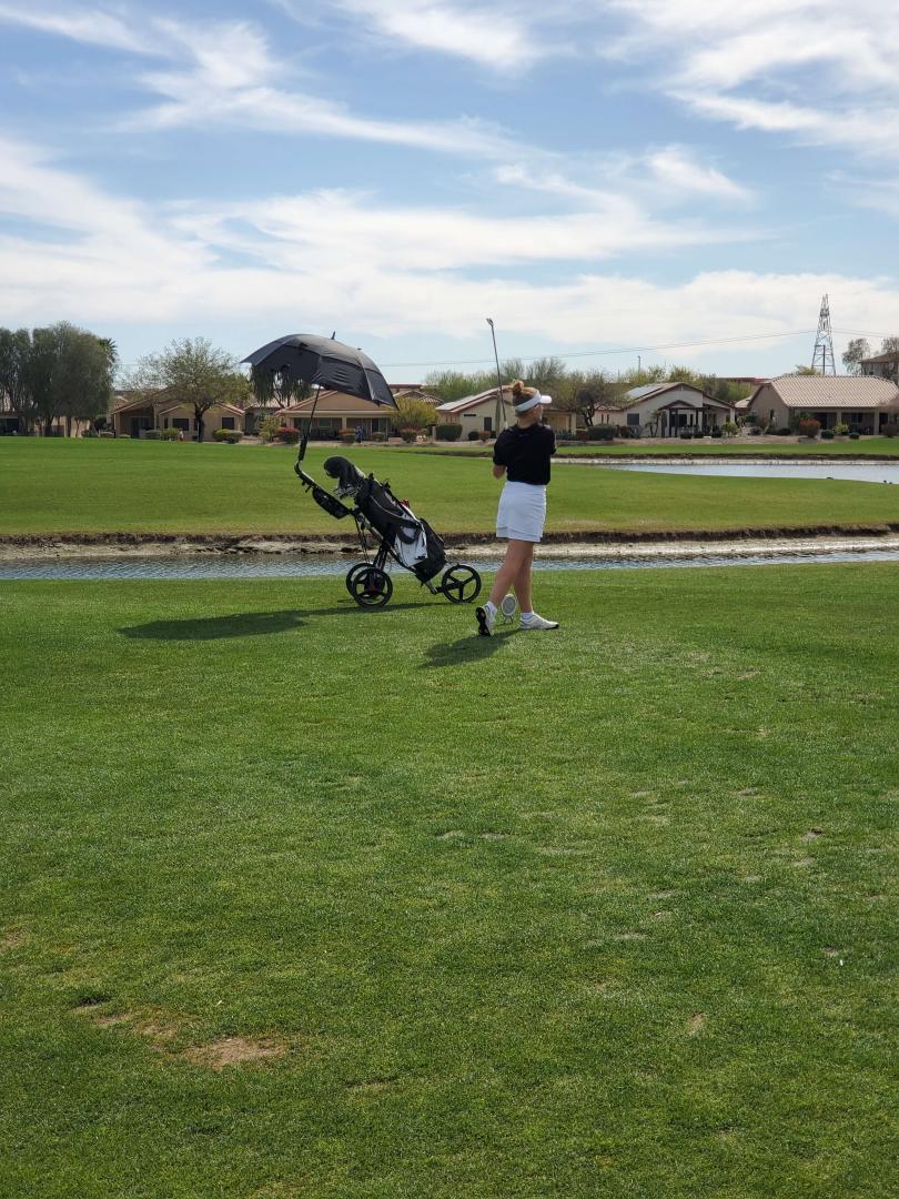 Students playing golf