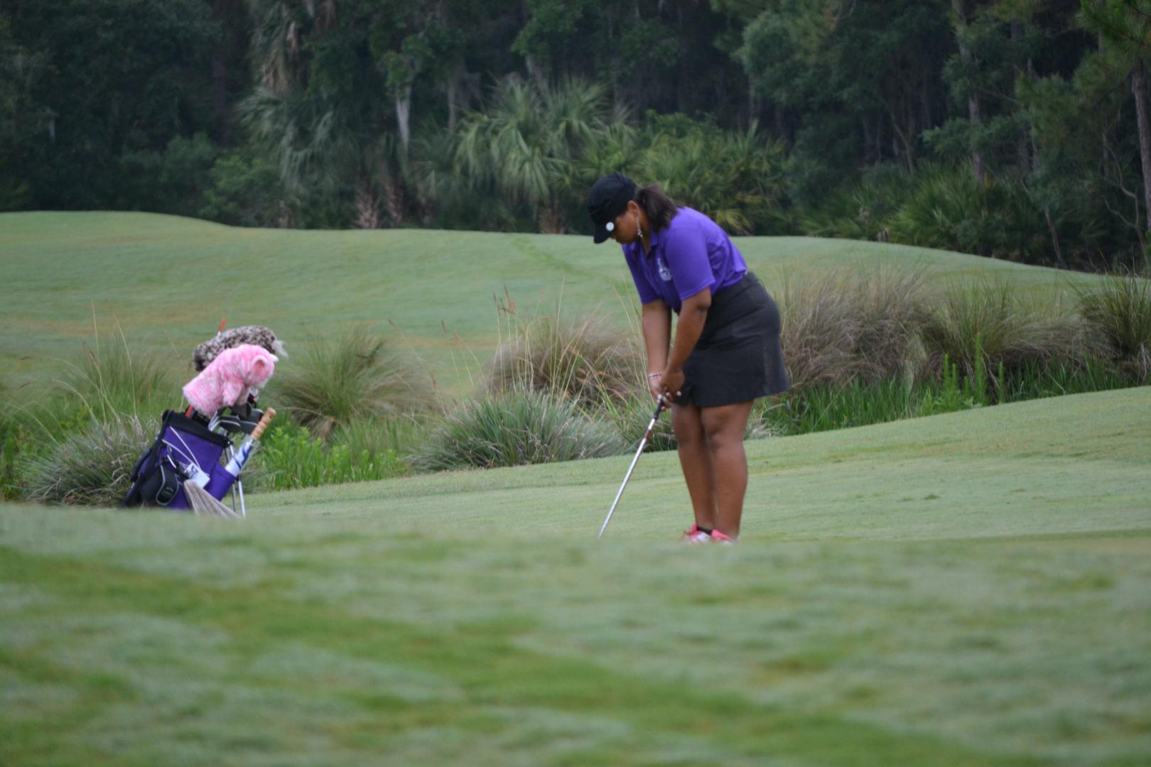 Students playing golf