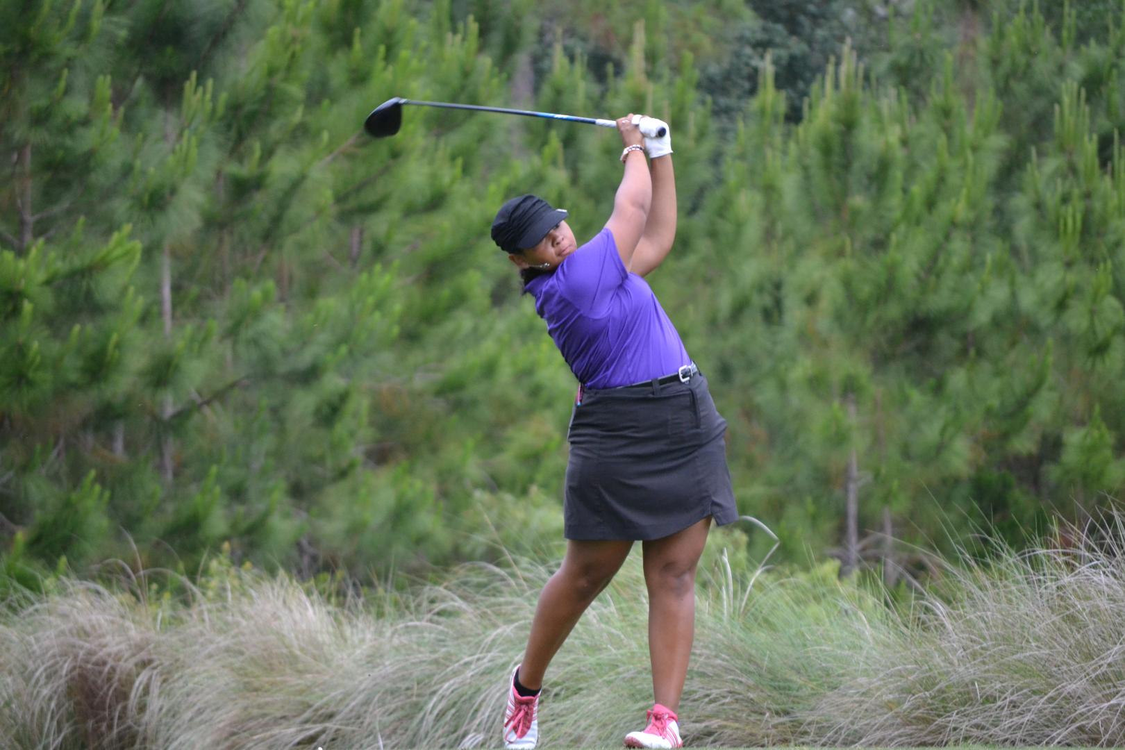 Students playing golf
