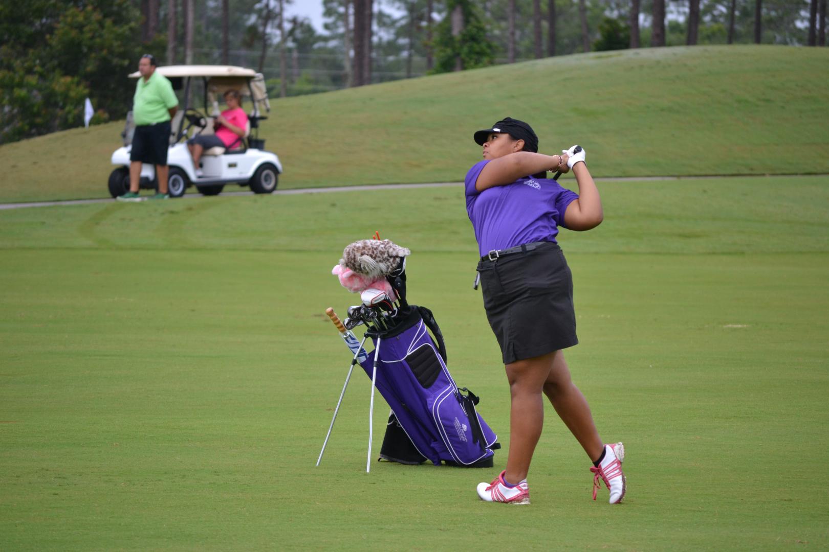Students playing golf