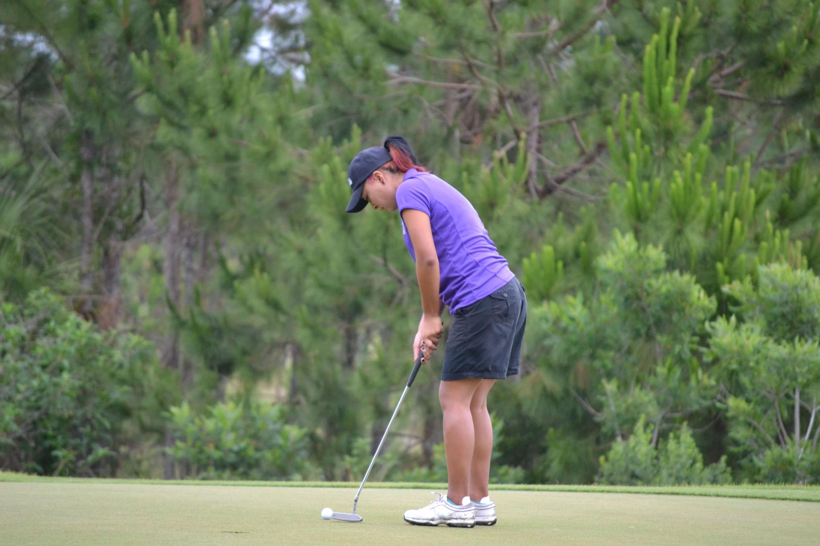 Students playing golf