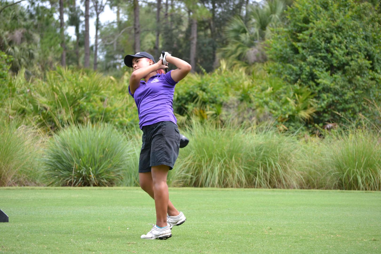 Students playing golf