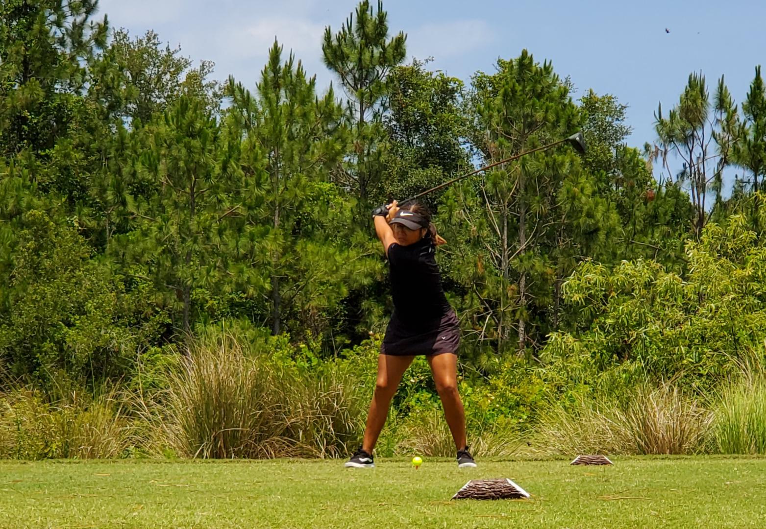 Students playing golf