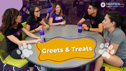 Students sitting a table talking.