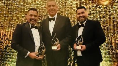 EMCC Pres. Rey Rivera, Associate Vice President Jonathan Robles, & Avondale Mayor/EMCC faculty Mike Pineda pose with their awards
