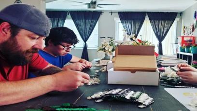 Tim Wilson and family assembling ear guards