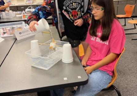 Young people working on a science experiment