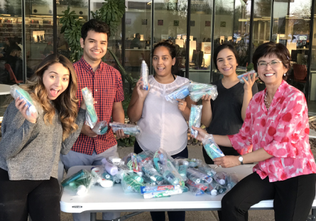 Nichole Grabowski with her student club members making hygiene kits.