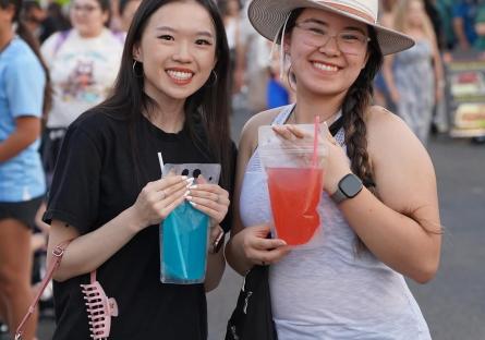 Two Desert West Market attendees enjoy drinks