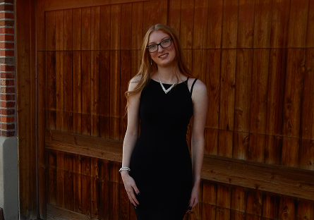 Madalynn Eidson outside in graduation attire.