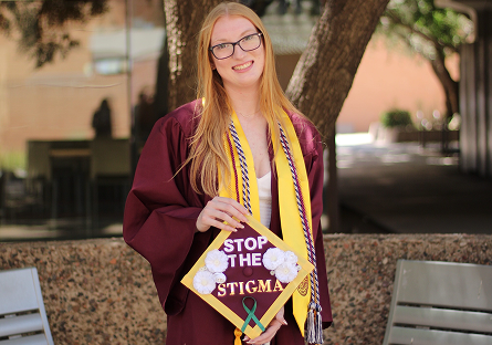 Madalynn Eidson outside in graduation attire.