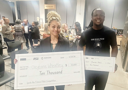 Cheyenne, Wheatley, and Xavier holding their prize money checks
