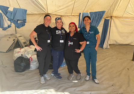 Amy Johnson, Ren Blake, Victoria De La Paz,  and Alysha Hall in their nursing scrubs.