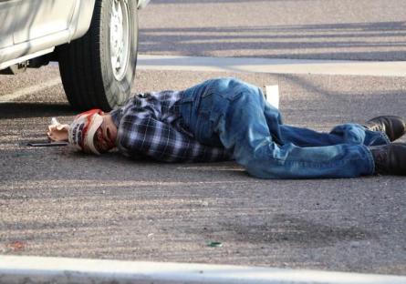 A dummy portraying a dead body.