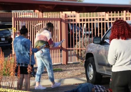 Students in parking lot.