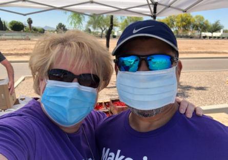 Two EMMC Staff taking a selfie with their covid masks.
