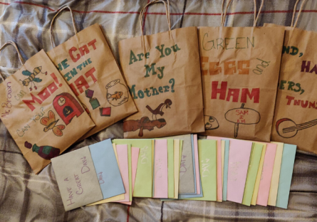 Alexis Ruiz book in a bag project showing brown paper bags decorated.