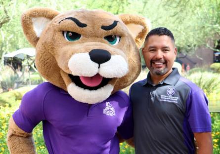 Dr. Rey Rivera and Roary, the mascot