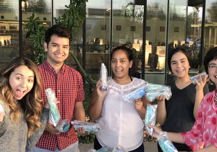 Nichole Grabowski with her student club members making hygiene kits.