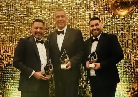 EMCC Pres. Rey Rivera, Associate Vice President Jonathan Robles, & Avondale Mayor/EMCC faculty Mike Pineda pose with their awards
