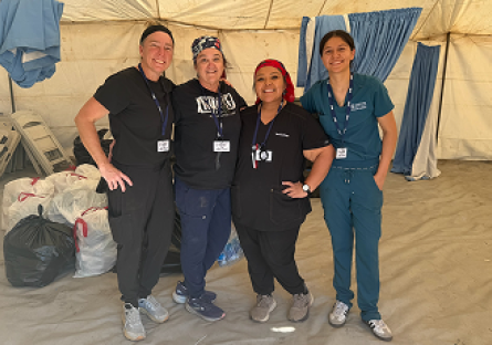 Amy Johnson, Ren Blake, Victoria De La Paz,  and Alysha Hall in their nursing scrubs.