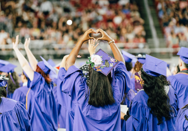 students celebrating at graduation