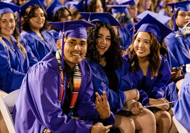 Students at commencement ceremony celebrating