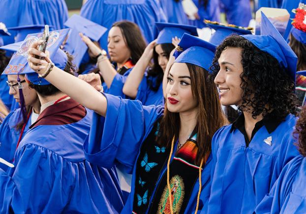 students celebrating at graduation